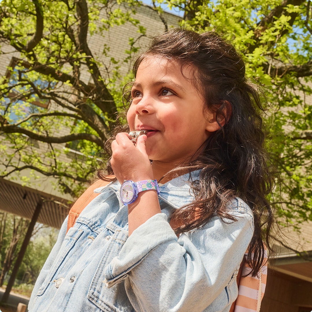 Children wearing Flik Flak watches outdoors
